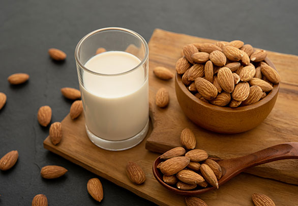 almond milk with almond wooden spoon bowl wooden - almond-milk-with-almond-wooden-spoon-bowl-wooden